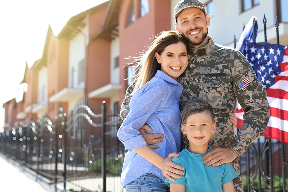 American soldier with family outdoors. Military service